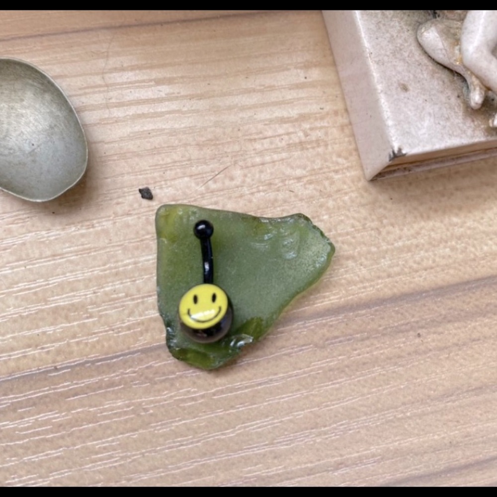 All black and yellow smiley face belly button jewelry